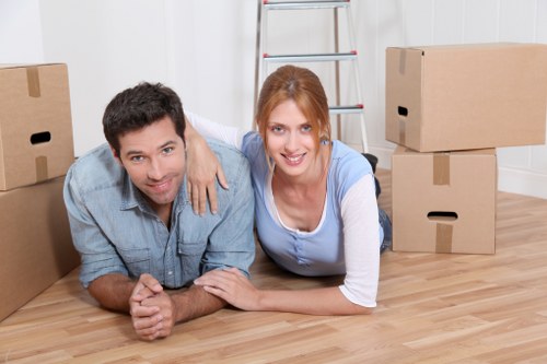 Professional removals team handling furniture during a Haroldwood house move